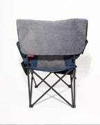 A folding camp chair with a grey faux fur fabric seat cover shown from the back on a white background.